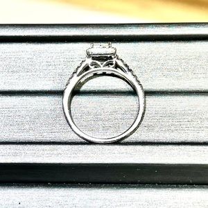 Size 8 White gold engagement ring with diamonds.